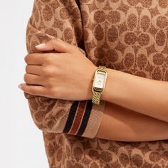 Inspired by the sleek designs of 1920s Art Deco the Cadie watch has an elegant long and lean silhouette. The gold tone bracelet timepiece features a dial detailed with our iconic Horse and Carriage motif. | Coach Cadie Watch, 20 Mm X 32.5 Mm - Women's - Gold Coach Women Watch, Luxury Coach Jewelry With Polished Finish, Luxury Coach Watch For Formal Occasions, Coach Cadie Watch, 2025 Wishlist, Square Watches, Art Deco Watch, Coach Watch, Horse And Carriage