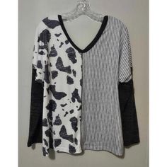 Elevate Your Wardrobe With This Chic Nwot Cow Print Striped Long Sleeve T-Shirt. Perfect For Women Who Want To Add A Touch Of Style To Their Everyday Outfit, This T-Shirt Features A Classic Striped Pattern And Long Sleeves That Will Keep You Warm And Comfortable. It Comes In Size Medium With A Regular Fit That Flatters Your Figure. The Black Color Offers A Timeless Look That Can Easily Be Paired With Any Other Clothing Item In Your Closet. This T-Shirt Is Made Of High-Quality Materials That Ensu Everyday Outfit, Cow Print, Striped Long Sleeve, Everyday Outfits, Clothing Items, The Black, Long Sleeve T Shirt, Black Color, Night Out