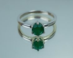 This is a beautiful Brazilian Emerald set in Sterling Silver. This amazing stone has the perfect deep green color that many look for in Emeralds accented beautifully by a 6 prong setting! This stone has visible inclusions and opaque clarity which is very common with Emeralds but also has a nice luster, you will not be disappointed!  Emeralds are the birthstone for May!  This perfect sized 6mm round cut Emerald weighs 0.740 and will go great with most styles or occasions. The size of these perfec Deep Green Color, Emerald Set, Herkimer Diamond, Emerald Ring, Deep Green, Gemstone Earrings, Prong Setting, Green Color, Green Colors