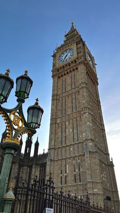 the big ben clock tower towering over the city of london in england, united kingdom