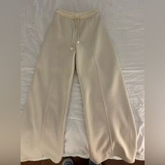 Brand New, Never Worn Chic Cream Wide Leg Full-length Pants, Chic Cream Full Length Wide Leg Pants, Cream Wide Leg Pants With Elastic Waistband For Spring, Beige Sweatpants With Pockets For Spring, Wide Leg Beige Sweatpants For Winter, Beige High Waist Relaxed Fit Sweatpants, Beige Full Length Sweatpants With Elastic Waistband, High Waist Beige Relaxed Fit Sweatpants, Chic White Winter Pants