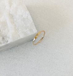 This listing is only for one reflections signet ring. Last 3 photos are stacking and style examples. This dainty and minimal band is handmade with 1.3mm wire and comes in your choice of gold filled, solid 14k or sterling silver metals. The signet band looks sophisticated and sleek on its own but also pairs well with the chevron bands from my shop. The top part of the ring is flattened and shiny. Maybe you can see your reflection in it? Dainty Everyday Initial Ring, Tarnish Resistant, Dainty Everyday Initial Ring Tarnish Resistant, Dainty Everyday Tarnish Resistant Initial Ring, Dainty Stackable Open Signet Ring, Dainty Gold Signet Ring For Everyday, Dainty Hypoallergenic Initial Ring For Everyday, Adjustable 14k Gold Signet Ring For Everyday, Dainty Yellow Gold Initial Ring For Everyday, Simple Gold Stackable Initial Ring