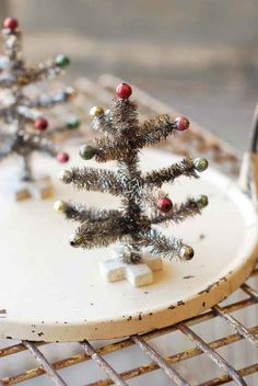 Mini Christmas Tree. Perfect for small Christmas vignettes. 
 5-1/2" tall. 
 Tinsel, wire, resin. 
 Imported. Tiny Christmas Trees, Tinsel Christmas Tree, Small Christmas Tree, Christmas Vignettes, Tinsel Tree, Navidad Diy, Mini Christmas Tree, Miniature Christmas, Noel Christmas