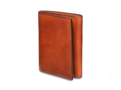 The Italia Double I.D. Trifold is a stylish option for the person who needs to carry multiple I.D.'s. The trifold design allows one ID to show by only unfolding the first flap. To reveal the second ID, you just unfold the entire wallet. We added six card slots to hold all of your credit, debit, business and loyalty cards. There is also a cash well for your paper bills and two receipts or "hidden" pockets. The Double ID Trifold is made from Dolce Leather, our most stunning Italian, hand-stained, Affordable Brown Leather Trifold Wallet, Brown Trifold Wallet For Daily Use, Minimalist Brown Trifold Wallet, Artisan Brown Leather Trifold Wallet, Brown Leather-lined Trifold Wallet, Loyalty Cards, Front Pocket Wallet, Rfid Wallet, Wallets For Women Leather