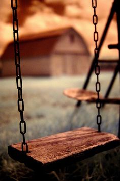 a wooden swing with the words, my house isn't fancy