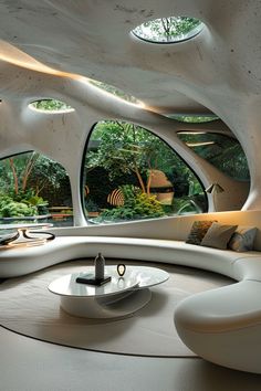 a living room filled with white furniture and lots of trees in the window sill