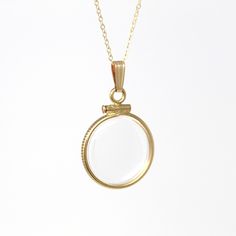 Timeless handcrafted brand new 14k gold filled empty shaker locket necklace! This classic pendant is dime sized with coin style bezels, and clear lucite covers. The round charm is shown modeled on a brand new 14k gold filled 20" chain, and is ready to be filled with your favorite gemstones, photos or keepsakes. An incredible piece of brand new jewelry, ready to hold your special findings!  ERA - Brand New METAL / MATERIAL - 14k gold filled locket, 14k gold filled chain, lucite clear covers, 1 screw (can be open and closed with a small screwdriver) MARKINGS / HISTORY - Bail is marked "1/20 14K G.F." on inside, chain is marked "14/20 G.F."    CONDITION - Excellent handcrafted brand new condition. The locket can be securely opened and closed with a small screw driver, such as ones intended fo Yellow Gold Charms Necklace Keepsake, Gold Round Locket Necklace With Charms, Minimalist Gold Jewelry For Keepsake, Minimalist Gold Jewelry As Keepsake, Antique 14k Gold Necklace With Charms, Heirloom Necklaces With Charms, Heirloom Round Charm Necklaces, Minimalist Yellow Gold Locket Necklace With Round Pendant, Yellow Gold Locket Charm Necklace Amulet Style