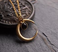 A bewitching necklace: the delicate onyx drop is a perfect match for the matte finished, 24k gold plated brass moon. This piece looks gorgeous worn on its own or is fantastic layered with other necklaces. ⟴ Onyx is the ancient birthstone for July and is associated with the zodiac sign of LeoTurquoise: https://www.etsy.com/ca/listing/735203333/moon-necklace-celestial-jewelryAmethyst: https://www.etsy.com/ca/listing/741246762/amethyst-necklace-boho-necklaceMoonstone: https://www.etsy.com/ca/listin Physical Manifestation, Witch Moon, Half Moon Necklace, Moon Necklace Silver, Black Onyx Necklace, Magic Aesthetic, Crescent Moon Pendant, Witch Jewelry, Celestial Necklace