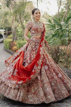 Red lehenga + twirling bride = Match made in heaven! Experimenting with bridal lehengas is quite trending but let's agree that no matter what trend comes or goes, one that never changes is that of the classic red bridal lehenga. It is traditional, blazing and complements the Indian skin tone beautifully. That is why, one can never go wrong with this colour. And these days, there are such gorgeous ones which are a perfect mix of traditional and contemporary! Raw Silk Blouse, Anand Karaj, Ballroom Costumes