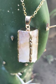 "Beautiful gold dipped and gold edged white raw druzy quartz pendant on gold colored clasp chain necklace. The rectangular prism shaped crystal is about 1\" long and 0.5\" wide. Please note that no two stones are alike and therefore color, shape and size may vary slightly. You can choose your necklace length from the drop-down menu. In case you would like a length besides the listed options, leave a note at checkout. Item will be shipped 1 - 2 business days after purchase. Back to my shop with i Gold Jewelry With Large Stone For Gift, Healing Gold Necklaces With Raw Stone, Gold Mineral Crystal Necklaces With Spiritual Style, Gold Mineral Crystal Spiritual Necklace, Gold Spiritual Mineral Crystal Necklace, Spiritual Gold Necklace With Raw Stone, Gold Necklace With Raw Stone, Gold Agate Gemstone Jewelry, Gold Quartz Crystal Necklace As Gift