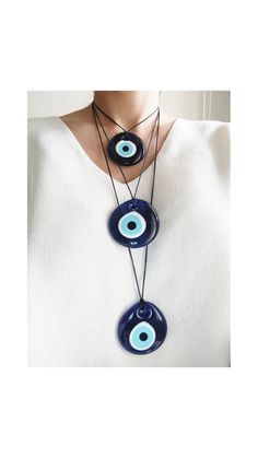 Evil eye necklaces are adjustable with 2 cord color options( dark blue and black) You can easily adjust the lenght of the nazar necklace. Blue evil eye pendant is 2 in (5 cm) Extra Large Evil Eye pendant is made of glass. This Turkish Eye Jewelry is great for daily wear. It would also be the perfect amulet gift. Please choose the longest lenght and the cord color of the necklace you prefer during check-out. For more evil eye necklaces, click the link below; https://www.etsy.com/shop/EyeDesignsby Nazar Necklace, Evil Eye Choker, Round Evil Eye, Necklace Evil Eye, Turkish Eye, Protection Amulet, Evil Eye Earrings, Protection Necklace, Blue Evil Eye