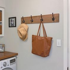 DRAKESTONE modern farmhouse rack made with solid knotty alder wood adds a warm and welcoming touch to any entryway, foyer, or mudroom. Organize your hats, scarves, and coats, or use it as a towel rack in your bathroom. The keyhole slots allow easy hanging, a flush wall mount, and sturdy support. TRINITY 4-Hook 32-in x 5.5-in H Walnut Decorative Wall Hook (20-lb Capacity) in Brown | MF4HKS32-SW Hook Board, Nursery Bookshelf, Knotty Alder, Decorative Wall Hooks, Hook Wall, Alder Wood, Rustic Lighting, Wall Racks, Walnut Stain