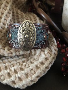 "Country leather bracelet cuff, western jewelry Embossed distressed genuine brown leather 1 1/2\" strap has been adorned with an oval southwestern silver concho which sets on a detailed antiqued copper filigree which has been given a rich patina. It is attached to the leather with two antiqued copper rivets. One antiqued copper snap has been placed to fit up to a 7 1/4\" wrist. I can add another snap if you would like a smaller or larger size but you need to convo me before purchasing The last p Cowgirl Bracelets, Turquoise Silver Bracelet, Western Bracelets, Looks Country, Chunky Bracelet, Leather Cuff Bracelet, Turquoise Boho, Chunky Bracelets, Southwestern Jewelry