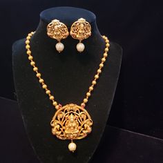 "Handmade Indian Temple Jewelry, best to wear it for traditional ceremonies or Indian wedding. This bridal jewelry has ethnic finish. It has Cubic Zircon stones with ruby and emeralds. It is a Bollywood style one gram jewelry. There are long and short patterns of Indian jewelry in Kundan, Pearls, CZ, American Diamond , ruby, emerald, Polki, kemp to suit every occasion of South Indian and North Indian weddings. Handmade Indian Jewelry item * Stunning Hand made Temple jewelry set. * Necklace Set i 22k Gold Temple Jewelry For Puja, Gold Temple Jewelry Set With Peacock Design, Temple Jewelry With Peacock Design For Puja, Festive Temple Jewelry Necklace With Peacock Design, Festive Temple Necklace With Peacock Design, Peacock Design Temple Jewelry For Puja, Bollywood Kundan Necklace With Peacock Design For Rituals, Gold Jewelry With Peacock Design For Rituals, Bollywood Temple Necklace With Peacock Design For Diwali