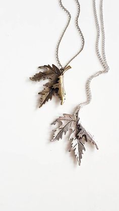 Statement Leaf Necklace, perfect for nature lovers in silver or bronze finish { D e s c r i p t i o n } The centerpiece of the necklace is a Canadian maple leaf pendant, which is known for its iconic and recognizable shape. The pendant is beautifully crafted with attention to detail, with every vein of the leaf captured.  The pendant is available in either a silver or bronze finish, allowing you to choose the color that best complements your personal style. The chain closes with a lobster clasp and is just the right length to sit comfortably against your chest. Great to wear over knits, thick blouses in autumn and winter. Also works amazingly with long bohemian dresses.  Whether you are looking for a piece of jewelry to wear for a special occasion, or you simply want to treat yourself to s Nature-inspired Silver Brass Necklaces, Nature-inspired Silver Brass Necklace, Nature-inspired Silver Brass Jewelry, Nature-inspired Silver Jewelry With Adjustable Chain, Nature-inspired Silver Metal Necklace, Nature-inspired Metal Jewelry With Oxidized Finish, Jewelry Rustic, Boho Nature, Bohemian Dresses Long