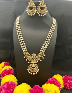 Embrace the cultural opulence of Long Rani Haram Set with Pearls, where each set is a work of art. Whether you're attending weddings, cultural events, celebrating important occasions, or simply seeking to add a meaningful touch to your attire, this necklace promises to adorn you with grace and the timeless charm of traditional jewelry. Elevate your style with cultural flair - order yours now! Here are some of the best ways to care for your artificial jewelry: *Keep it dry away and from moisture. Bohemian Jewelry Sets With Intricate Design For Celebration, Elegant Beaded Necklaces For Diwali Celebration, Elegant Beaded Necklaces For Diwali, White Round Beads Necklace For Diwali, White Round Beaded Necklaces For Diwali, Temple Jewelry Beaded Necklace With Intricate Design For Festivals, White Beaded Necklace For Diwali Celebration, White Beaded Necklaces For Diwali Celebration, White Beaded Jewelry Sets For Festivals