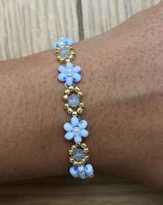 Viral flower and beaded bracelets. Cheap White Flower Beaded Bracelets, Flower Wire Bracelet, Affordable Flower-shaped Beaded Bracelets For Birthdays, Dainty Flower-shaped Beaded Bracelets, Adjustable Flower-shaped Beaded Bracelets With Tiny Beads, Dainty Flower-shaped Beaded Bracelet With Colorful Beads, Bead Flower Bracelet, Adjustable Beaded Flower-shaped Bracelets, Cheap Yellow Flower-shaped Beaded Bracelets