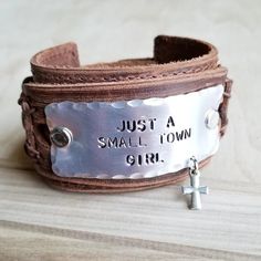 Just A Small Town Girl Hand Stamped Leather Cuff Just A Small Town Girl, Hand Stamped Metal, Stamped Leather, Metal Stamped Jewelry, Girl Hand, Small Town Girl, Fine Silver Jewelry, Hand Stamped Jewelry, Leather Cuffs Bracelet