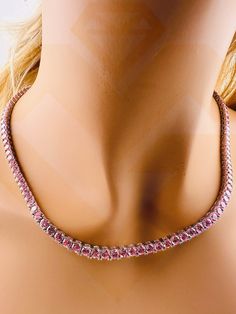 Introducing our Sparkly Pink Tennis Chain, a dazzling and vibrant accessory that transcends conventional jewelry. This exquisite piece is designed for both men and women who crave a touch of flamboyance in their style. The focal point of this tennis necklace is the VVS Fiery Pink Gemstones, which emulate the brilliance of genuine diamonds, creating a stunning and eye-catching display. Crafted with meticulous attention to detail, the simulated diamonds on this tennis chain rival the sparkle of re Pink Chain Jewelry For Formal Occasions, Pink Link Jewelry For Gifts, Formal Pink Jewelry With Adjustable Chain, Formal Pink Jewelry With Chain Detail, Formal Pink Jewelry With Chain, Formal Pink Chain Jewelry, Round Tennis Necklace Chain As Gift, Pink Link Jewelry With Adjustable Chain, Pink Tennis