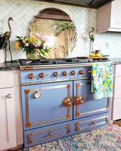 an old fashioned blue stove in a kitchen