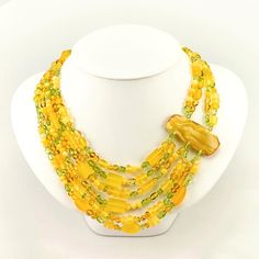 Bozena Przytocka is a designer of artistic amber jewelry based in Gdansk, Poland. Here is a beautiful example of her ability to blend amber and peridot to create a stunning necklace. Yellow Multi-strand Jewelry Gift, Yellow Multi-strand Jewelry As A Gift, Handmade Yellow Double Strand Jewelry, Luxury Multi-strand Necklace For Gift, Handmade Yellow Double Strand Necklace, Luxury Handmade Multi-strand Jewelry, Luxury Handmade Double Strand Necklace, Handmade Double Strand Yellow Necklace, Handmade Amber Multi-strand Necklace