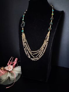 Beautiful layered chain necklace, 50s style, composed of aluminum chain, black agate beads, handmade components and hand-painted glass beads. The necklace is made up of 5 strands of golden chain alternating with small agate chips. The peculiarity of this necklace are handmade components with the bead weaving technique, they are large, colorful and bright pearls. The back of the necklace is made with agate beads. Everything matches perfectly, colors and shapes. The necklace is very elegant, perfect for low-cut evening dresses but also for a single-colored winter sweater. The necklace is 56 cm long but the length can be extended by another 10 cm. The necklace is asymmetrical and very versatile. Perfect for those who love elegant style. All jewels are delivered in a decorated box, ready to be Party Beaded Chain Necklace With Metal Beads, Party Metal Beaded Chain Necklaces, Party Beaded Necklace With Metal Beads, Beaded Long Chain Necklace For Parties, Metal Beaded Necklaces With Round Beads, Metal Beaded Necklace With Black Beads For Party, Metal Beaded Chain Necklace For Gift, Handmade Black Necklace With Czech Glass, Handmade Black Czech Glass Necklaces