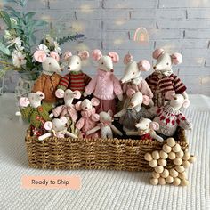 a basket filled with stuffed animals sitting on top of a table