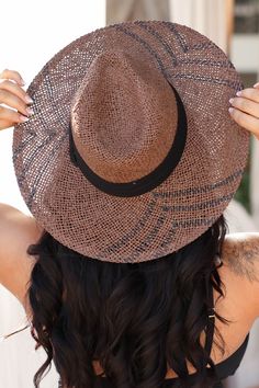 This unique hat adds some chic vibes to your typical beach wear! The fun black details make it easy to transition this one off the beach and into any casual look. Brown, straw, women's wide brim sun hat featuring unique weaved design with black detailing and thick black strap detail. 90% Paper, 10% Polyester. Brim - 4", Inner circumference - 22.5". Shop all colors here. **Final sale item. Casual Black Paper Straw Hat, Trendy Woven Straw Sun Hat, Black Brimmed Fedora For Summer, Casual Paper Straw Hat For Sunbathing, Chic Paper Straw Hat For Beach, Black Paper Straw Hats For Summer, Black Paper Straw Hat For Vacation, Black Straw Hat With Curved Brim For Vacation, Lightweight Black Straw Hat