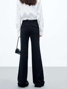 MO&Co. Women's High Waist Tailored Pants Feel confident and stylish with these tailored pants. Crafted from pure wool, with a straight-leg cut and a flattering drape, these pants feature a zip, hook and button closure as well as side pockets. Elevate your look with the perfect blend of sophistication and chic – pair them with a shorter top for a truly unique and fashionable ensemble. Features : - Straight cut with slightly wide hems- Zipper, hook and button closure- Double side pocket design Cod Black Straight Pants With Concealed Placket, Chic Wide Leg Dress Pants With Concealed Placket, Black Wool Wide Leg Office Pants, Office Dress Pants With Pockets And Full Length, Office Dress Pants With Pockets Full Length, Chic Tailored Work Pants For Office, Wide Leg Office Pants With Concealed Placket, Full Length Office Dress Pants With Pockets, Fall Business Pantsuit Trousers