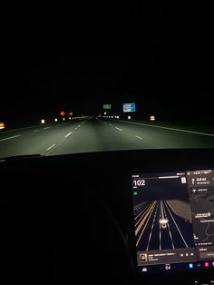 the dashboard of a car driving at night