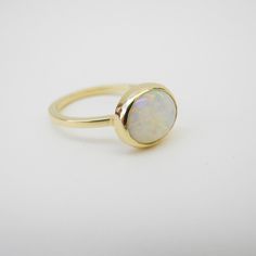 Heirloom Stackable White Jewelry, White 14k Gold Jewelry With Round Stone, Opal Rings With Polished Finish For Formal Occasions, Formal Opal Rings With Polished Finish, Classic White Sapphire Gemstone Ring, Modern 14k Gold Opal Ring With Polished Finish, Modern Opal Ring In 14k Gold With Polished Finish, Classic Opal Jewelry With Polished Finish, Elegant Opal Open Ring With Polished Finish