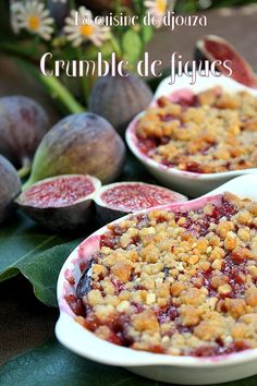 two white bowls filled with crumbled fruit next to some figs and leaves