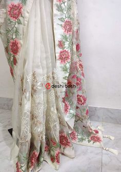 This exclusive boutique designer hand made Muslin saree is a perfect and unique choice for your occasional and party wear. All Over Delicate Neat Flower Embroidery, and Tassels Work. Matching Running Blouse Piece. Color: There might be slight color variation due to lightings and flashes while photo shooting. The color may also vary because of different screen resolutions. Wash Care: Dry Clean Only. Note: This is a hand made boutique saree and could take 1 to 2 weeks longer than the estimated dis Eid Floral Embroidered Tissue Silk Pre-draped Saree, Chanderi Pre-draped Saree With Floral Embroidery, Floral Embroidered Chanderi Pre-draped Saree, Anarkali Style Floral Embroidered Chanderi Pre-draped Saree, Festival Pre-draped Saree In Tissue Silk With Floral Embroidery, Festival Tissue Silk Pre-draped Saree With Floral Embroidery, Embroidered White Pre-draped Saree For Festivals, White Organza Pre-draped Saree For Eid, Semi-stitched Art Silk Saree With Floral Embroidery