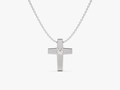 Embrace the power of faith in a minimalist way with the Small Cross Necklace. This understated piece features a delicate cross pendant, perfect for everyday wear and layering. Crafted from gleaming precious metal, the cross serves as a constant reminder of your faith, even when close to your heart. The small size ensures this necklace offers a touch of faith without overwhelming your outfit. It's perfect for those who prefer minimalist jewelry or for everyday wear. FEATURES• Made to Order• Gold Minimalist Cross Pendant Necklace For Formal Occasions, Minimalist Cross Pendant Jewelry For Formal Occasions, Minimalist Cross Pendant Jewelry For Formal Events, Minimalist White Gold Cross Necklace For Gift, Minimalist White Gold Cross Necklace As Gift, Minimalist White Gold Cross Necklace Gift, Everyday Classic Cross Pendant Necklace, Classic Everyday Cross Pendant Necklace, Classic Everyday Cross Necklace