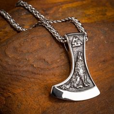 A striking double-sided necklace in 316L Stainless Steel and matching wheat chain. Design features a Valknut symbol and a flying Raven on one side and a howling Wolf on the other. Pendant dimensions: approx 1.7" x 1.18" ( 4.3 x 3cm) Chain length approx 23.5" ( 60cm ) Viking Style Engraved Sterling Silver Jewelry, Collectible Viking Sterling Silver Jewelry, Viking Style Sterling Silver Round Pendant Jewelry, Viking Style Sterling Silver Pendant Jewelry, Viking Sterling Silver Pendant Jewelry, Viking Style Sterling Silver Pendant, Engraved Viking Style Necklace, Adjustable Viking Style Jewelry Gift, Viking Style Sterling Silver Nickel-free Necklace