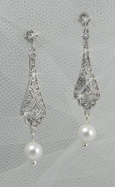 Earrings White Intricate Design Drop Earrings, Teardrop Jewelry With Intricate Design For Wedding, Teardrop Wedding Jewelry With Intricate Design, White Intricate Dangle Jewelry, Silver Chandelier Earrings With Intricate Design For Formal, Elegant Hand Set Crystal Earrings, Elegant Hand Set Crystal Earrings For Gift, White Pierced Chandelier Earrings For Formal Occasions, Ornate Dangle Jewelry