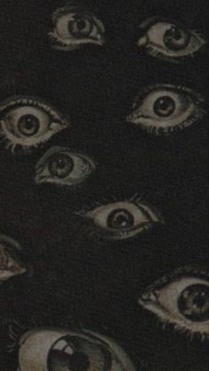 an image of many different eyes in the dark