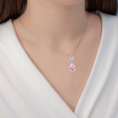 Lavencious is proud to present its exquisite Teardrop Dangle with AAA Pink Cubic Zirconia Necklace & Earrings Set. This hand-crafted set is made with brilliance and care, featuring high-grade AAA pink cubic zirconia stones, making it a luxurious addition to any jewelry collection. The necklace and earrings feature a classic teardrop silhouette, ensuring timeless elegance. - Necklace is 16" x 3" length,pendant and earrings are the same size : 1.18" x 1.18" - Rhodium Plated to enhance shine and du Cubic Zirconia Pendant Jewelry Sets For Gifts, Fine Jewelry Teardrop Sets For Anniversary, Teardrop Fine Jewelry Sets For Anniversary, Pink Jewelry Sets For Mother's Day, Pink Pear-shaped Gemstone Jewelry, Pink Pear-shaped Diamond Jewelry, Anniversary Teardrop Fine Jewelry Sets, Pink Crystal Jewelry For Mother's Day, Pink Teardrop Crystal Jewelry