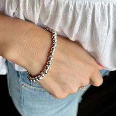 ...chic and timeless. Our Beaded Stack Bracelet comes to you in sterling silver stretch style. Sterling bead bracelets are chic and timeless and never go out of style. Available in 6mm beads and you pick the bracelet size, small/medium, medium/large, or large/x-large. Wear one or combine it with additional stacks to create your own custom look. Metal: .925 Sterling SilverFinish: High PolishMSRP: $129.99-$139.99 Part of the appeal of handcrafted sterling silver jewelry includes slight variations Dainty Silver Stackable Stretch Bracelet, Stackable Round Stretch Bracelet, Dainty Silver Stretch Bracelet, Casual Hand-strung Stretch Bracelet, Silver Jubilee Stretch Bracelet For Everyday, Elegant Flexible Beaded Jewelry, Elegant Beaded Flexible Jewelry, Trendy Round Stretch Bracelet For Everyday, Silver Stackable Bracelet With Round Beads