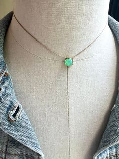 So lovely. Features a vintage green glass opal stone set inside a brass setting, nylon cord. Select length on the menu. The necklace will be gift boxed. Adjustable Dainty Green Necklace, Green Necklace With Adjustable Length For Gift, Green Minimalist Choker Jewelry, Green Necklace With Tiny Oval Beads, Adjustable Green Charm Necklace, Green Charm Necklace With Adjustable Chain, Dainty Green Choker Necklace, Dainty Green Tarnish-resistant Necklace, Dainty Green Adjustable Choker