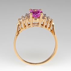 This sweet ring is centered with an oval cut pink sapphire, weighing 1.00 carat, in a four-prong setting. The shoulders are each bead set with six (6) round brilliant cut diamonds. The ring measures 6.9mm at the top, rises 6.3mm above the finger, tapering to 2.0mm wide and 0.7mm thick at the base of the shank. The ring currently fits a size 4.75. Sweet Ring, Oval Cut, Round Brilliant, Sapphire Diamond, Round Brilliant Cut Diamond, Brilliant Cut Diamond, Pink Sapphire, Prong Setting, Sapphire