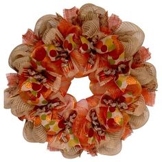 an orange and tan wreath on a white door