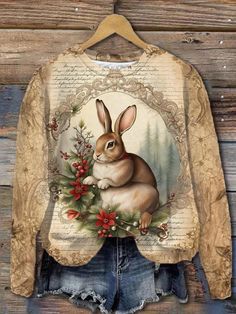 an image of a shirt with a rabbit on the front and flowers in the back