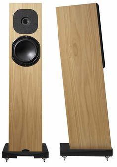 two wooden speakers sitting side by side on metal stands, one is black and the other is light wood