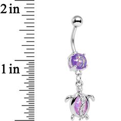 Product DescriptionPurple Pink Faux Opal Beach Turtle Dangle Belly Ring Make an awe-inspiring effort to go with the flow . . . of the sea when you wear this 14 gauge reptile-inspired belly button ring! Made with a 7/16" durable 316L surgical grade stainless steel curved barbell, this navel piercing features a purple bottom faux opal as well as a turtle dangle charm set with a single pink faux opal and a strip of clear gems for a little extra eye-catching detail. Specifications14 Gauge (1.6mm), 7 Purple Dangle Jewelry For Beach, Lizard Belly Button Ring, Opal Body Jewelry, Beach Turtle, Nickel-free Pink Belly Rings As Gift, Adjustable Nickel-free Pink Belly Rings, Nickel-free Dangle Belly Rings In Sterling Silver, Purple Bottom, Dangle Belly Button Piercing Tummytoys® At The Belly Ring Shop