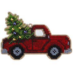 a red truck with a christmas tree on the back is shown in front of a white background