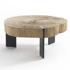 a wooden table with black metal legs and a wood slab on the top that has been cut in half