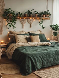 a bed with green linens and plants on the headboard, hanging above it