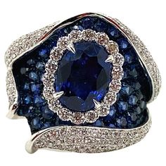 Luxury Fine Jewelry Sapphire Ring As Gift, Dazzling Sapphire Oval Diamond Ring, Dazzling Oval Sapphire Diamond Ring, Dazzling Oval Sapphire Ring With Brilliant Cut, Luxury Oval Diamond Ring, Dazzling Oval Sapphire Gemstone Ring, Luxury Oval Sapphire Ring For Anniversary, Oval Sapphire Ring With Pave Setting For Anniversary, Oval Sapphire Ring With Pave Setting In Platinum