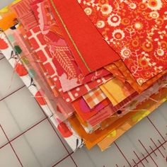 a pile of fabric sitting on top of a cutting board